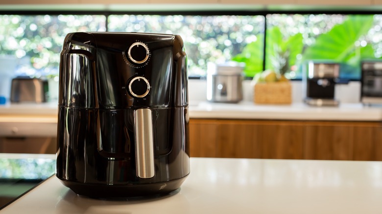 Clean black air fryer on kitchen counter