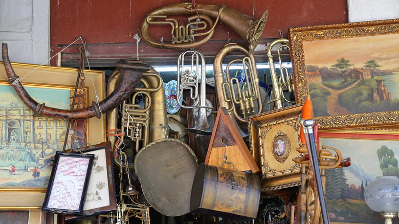 Flea market stand with paintings and instruments