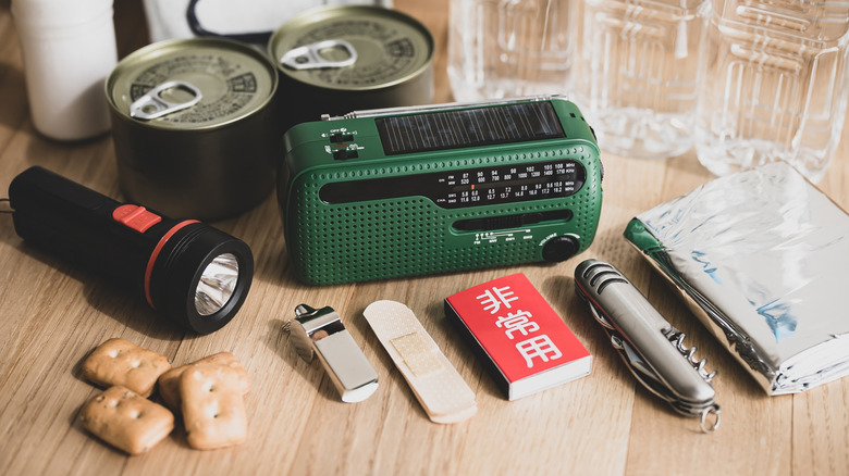 Emergency kit supplies on wood floor