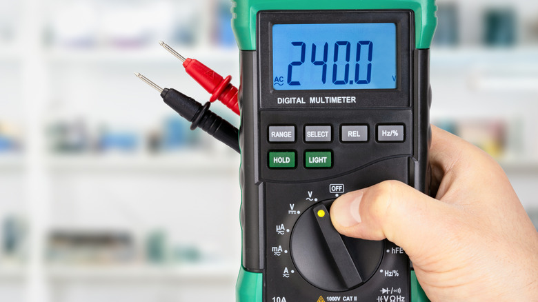 Setting a digital multimeter to read AC voltage