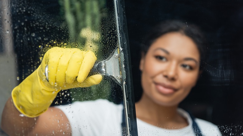 Woman washing windows