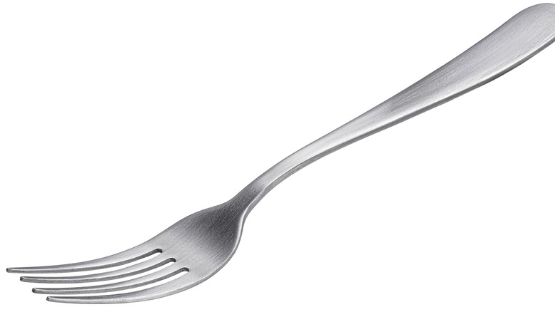 Silverware fork on white background