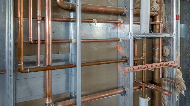 Exposed pipes installed in framing