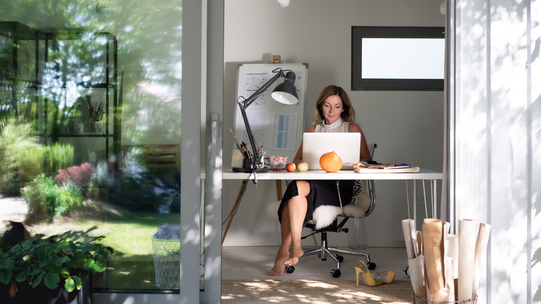 Woman working in shed office