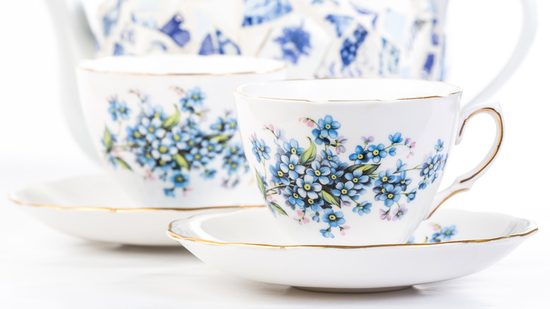 white teacups with gold trim