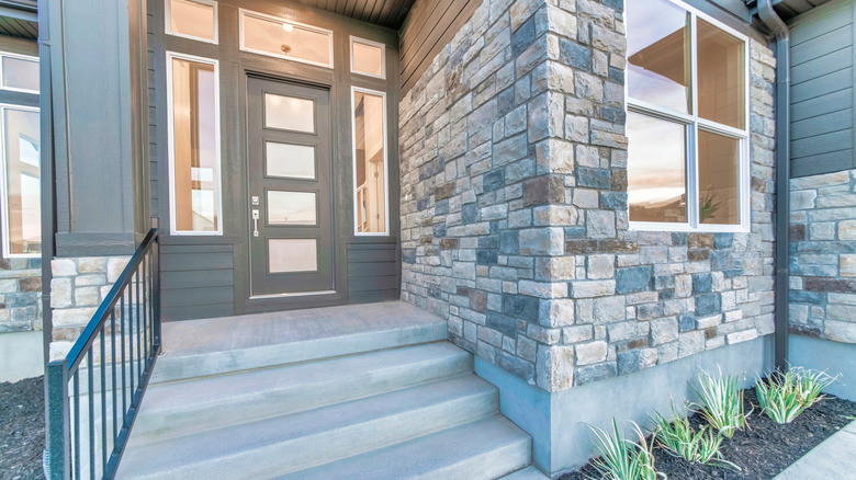 Stone siding installed above grade