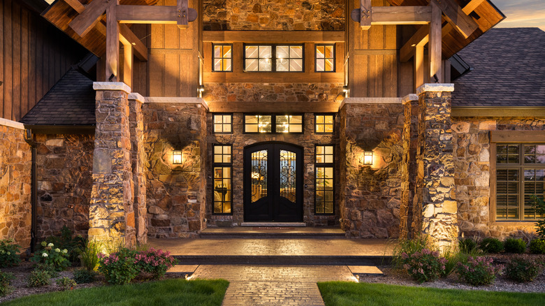 Home with stone siding at sunset