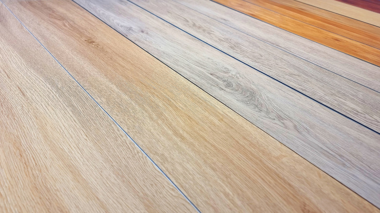 Planks of vinyl flooring are shown up close.