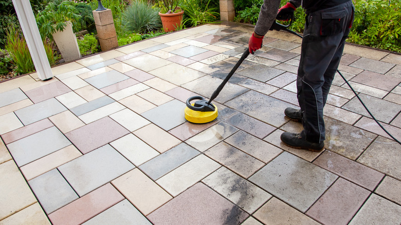 cleaning colorful concrete patio