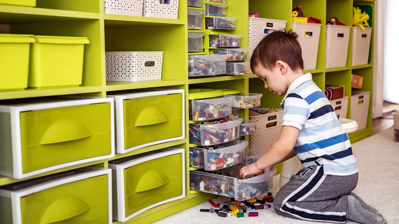 a child using vertical storage solutions