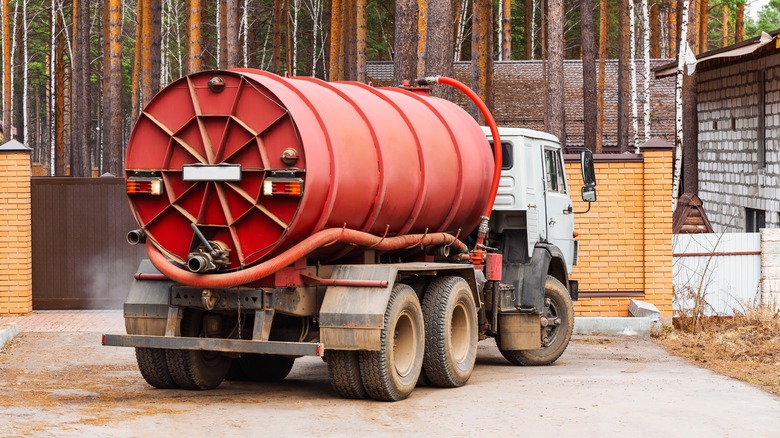 sewage pump truck with red tank