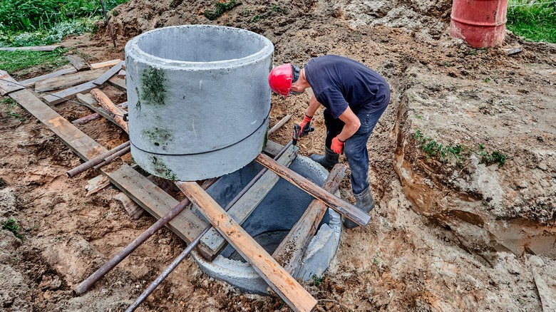 concrete bit of septic tank being installed