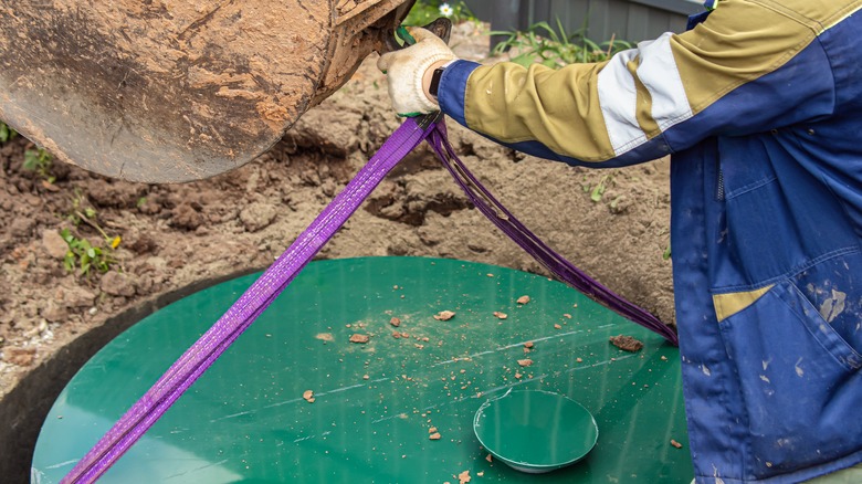 Person installing a septic tank