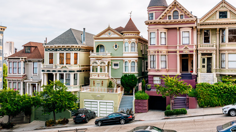 A line of Victorian homes with elegant landscaping.