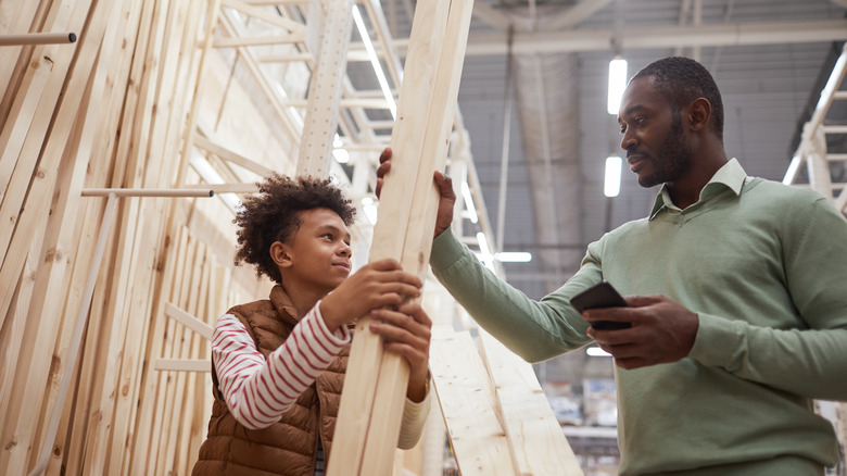 father and son shopping for lumber