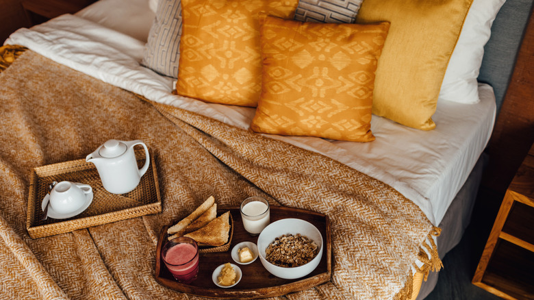 Cozy bed with breakfast trays