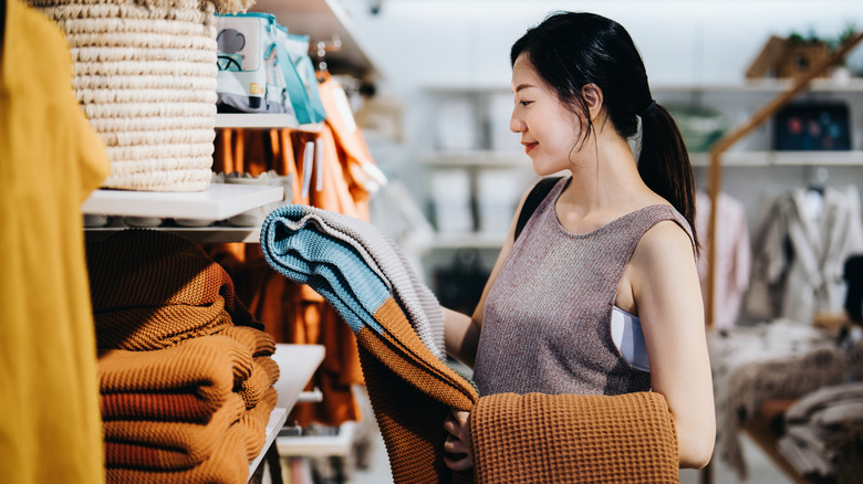 Woman shopping for blankets