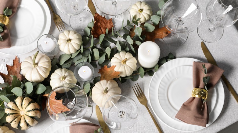 Tablescape with white pumpkins and eucalyptus