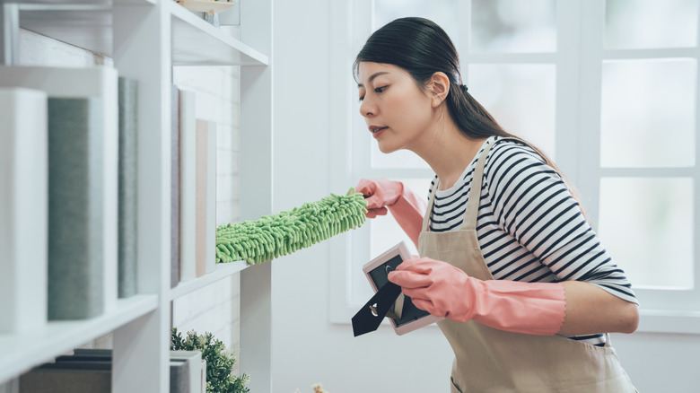 Person using reusable duster