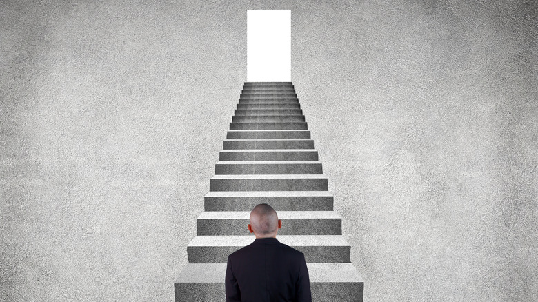 A man looking at stairs 