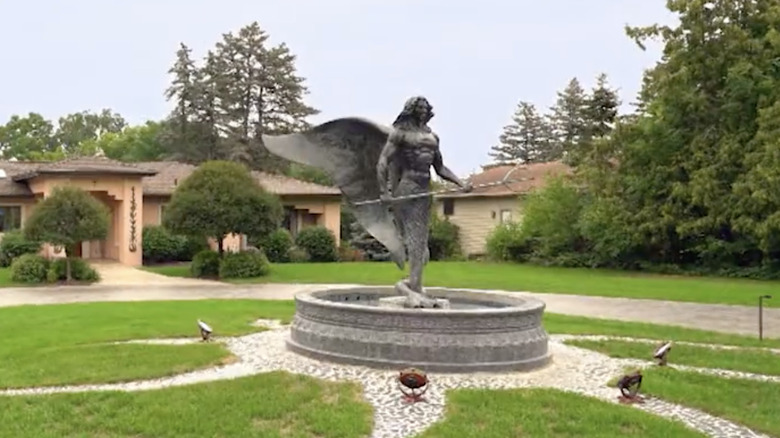 Poseidon statue in circle driveway