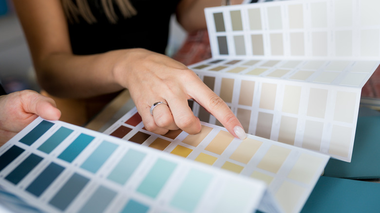 person choosing paint color