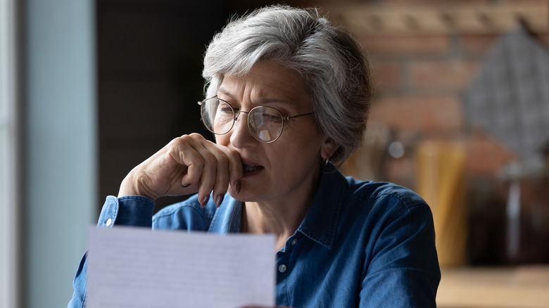 Older adult looks pensive 