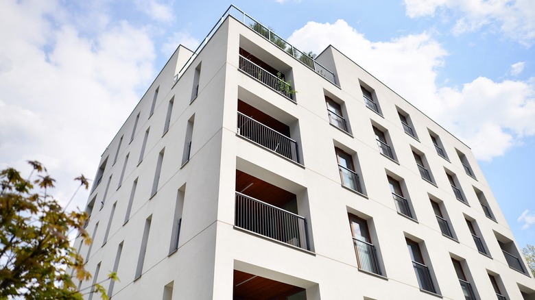 white condo building blue sky