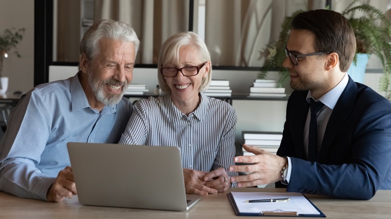 Older couple with younger man