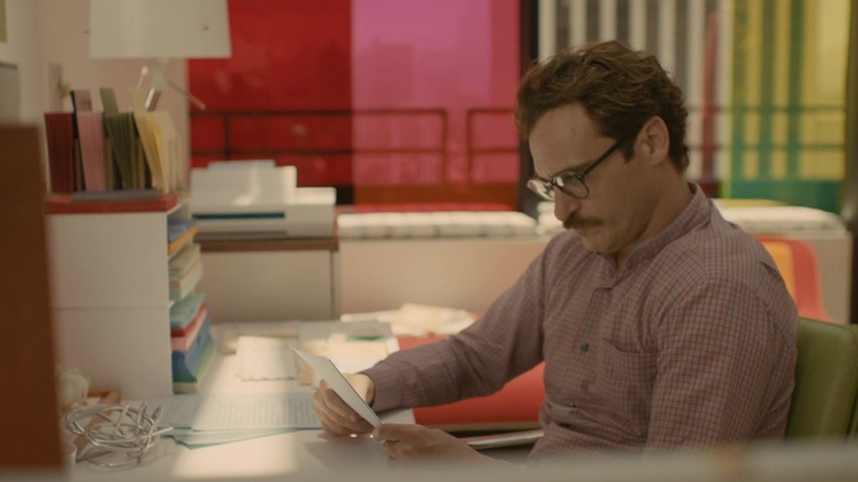 man at office desk