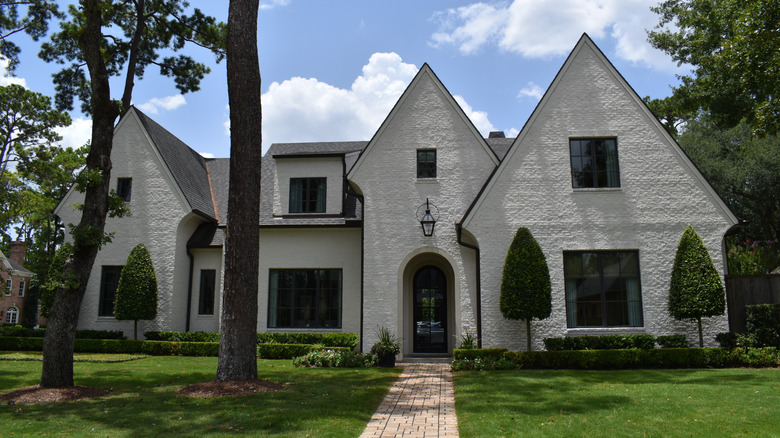 A large white house with stucco siding