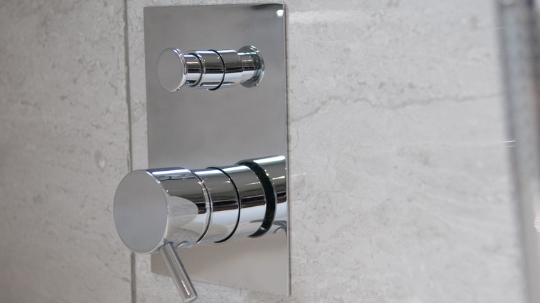 Push button shower diverter