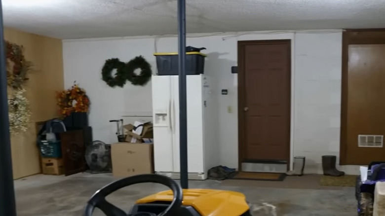 Cluttered garage with boxes and holiday decorations