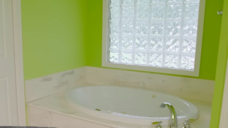 White tub and neon green walls