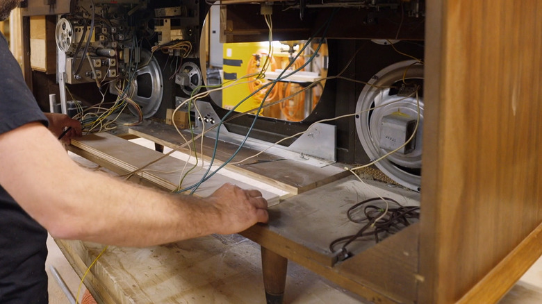 Dave Marrs evaluating console cabinet