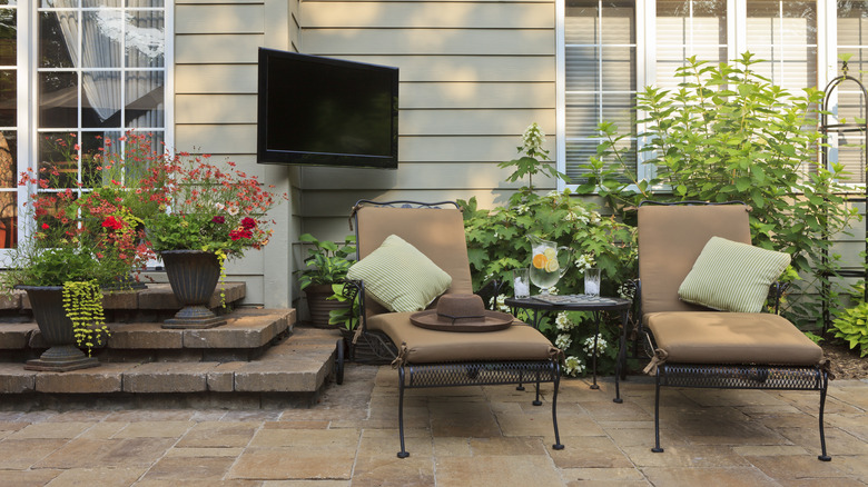 Outdoor patio with mounted TV