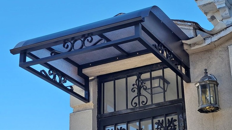 Decorative black metal window awning