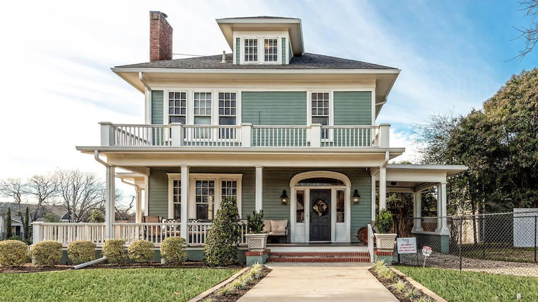 Green and white victorian house