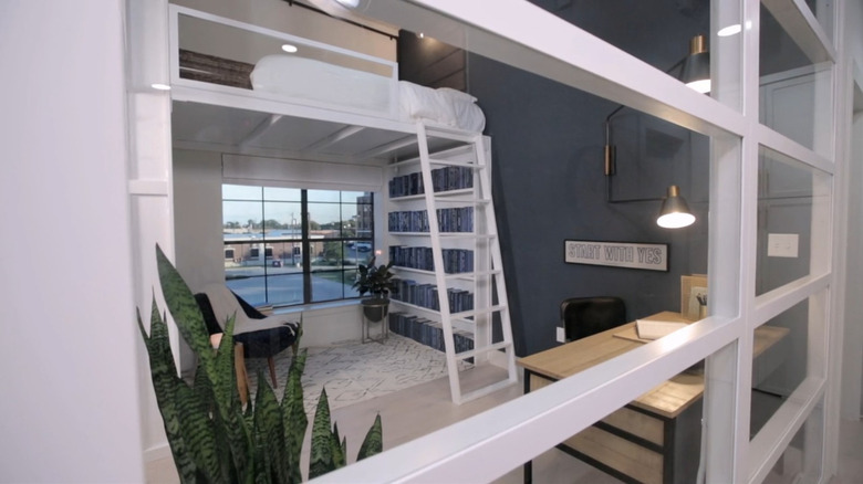 A modern bed loft with a ladder