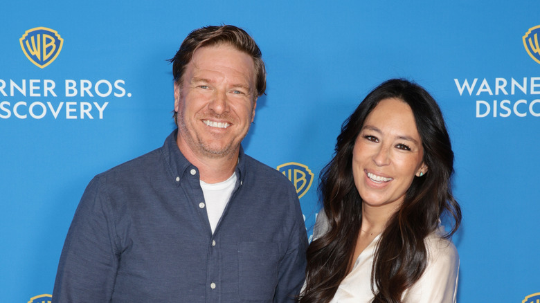 Chip and Joanna gaines smiling at an event