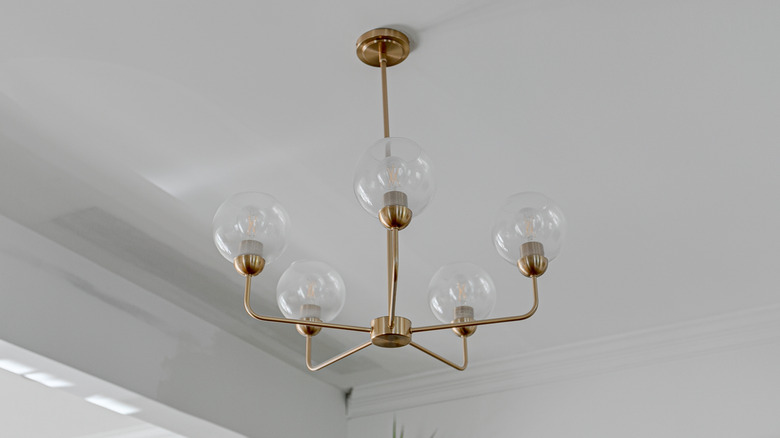 A brass mid-century modern chandelier.