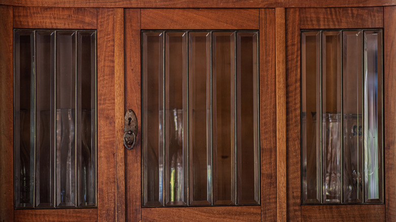 Antique wooden cabinet doors with glass windows