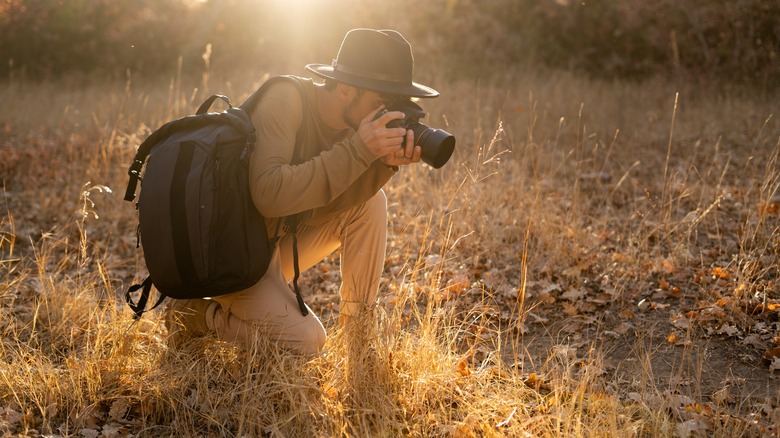 man taking photograph