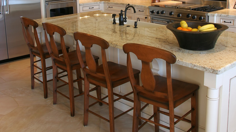 Beige flagstone flooring inside kitchen