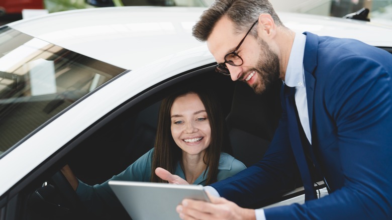 Woman smiling in car