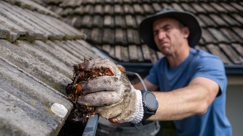 A man cleaning gutters 