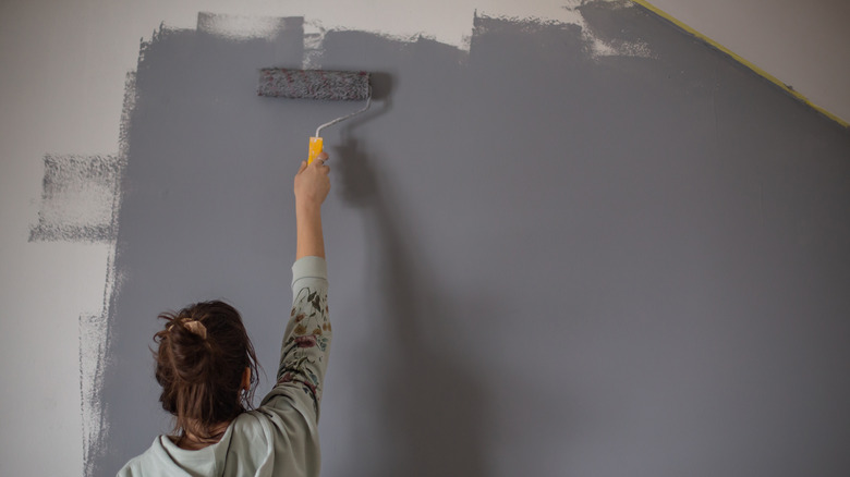 woman painting a wall