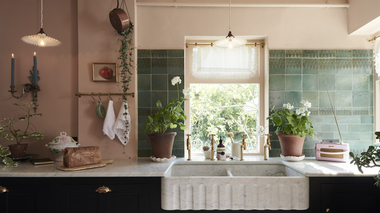 Kitchen sink with green tile backsplash from deVOL Kitchens