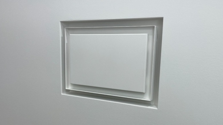 Flush wall vent on white wall