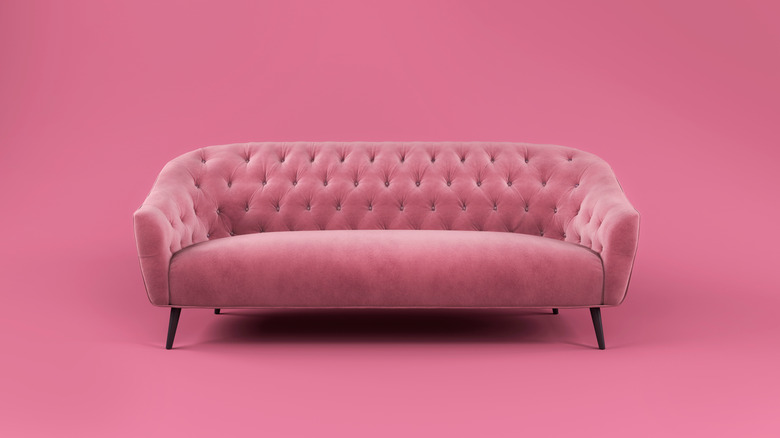 Pink tufted couch